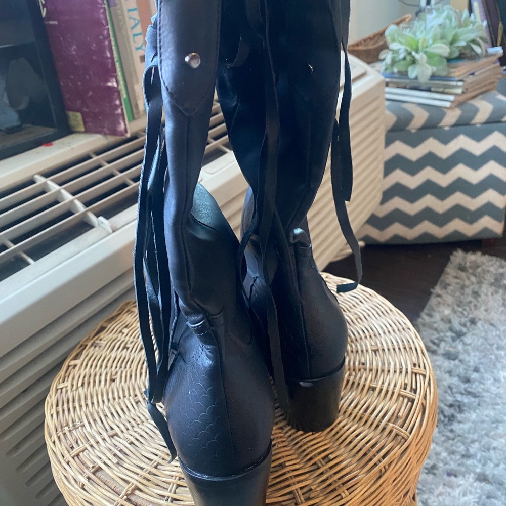 Size 42 (euro) cowboy style black boots. Never worn